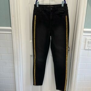 Black jeans with gold accents
